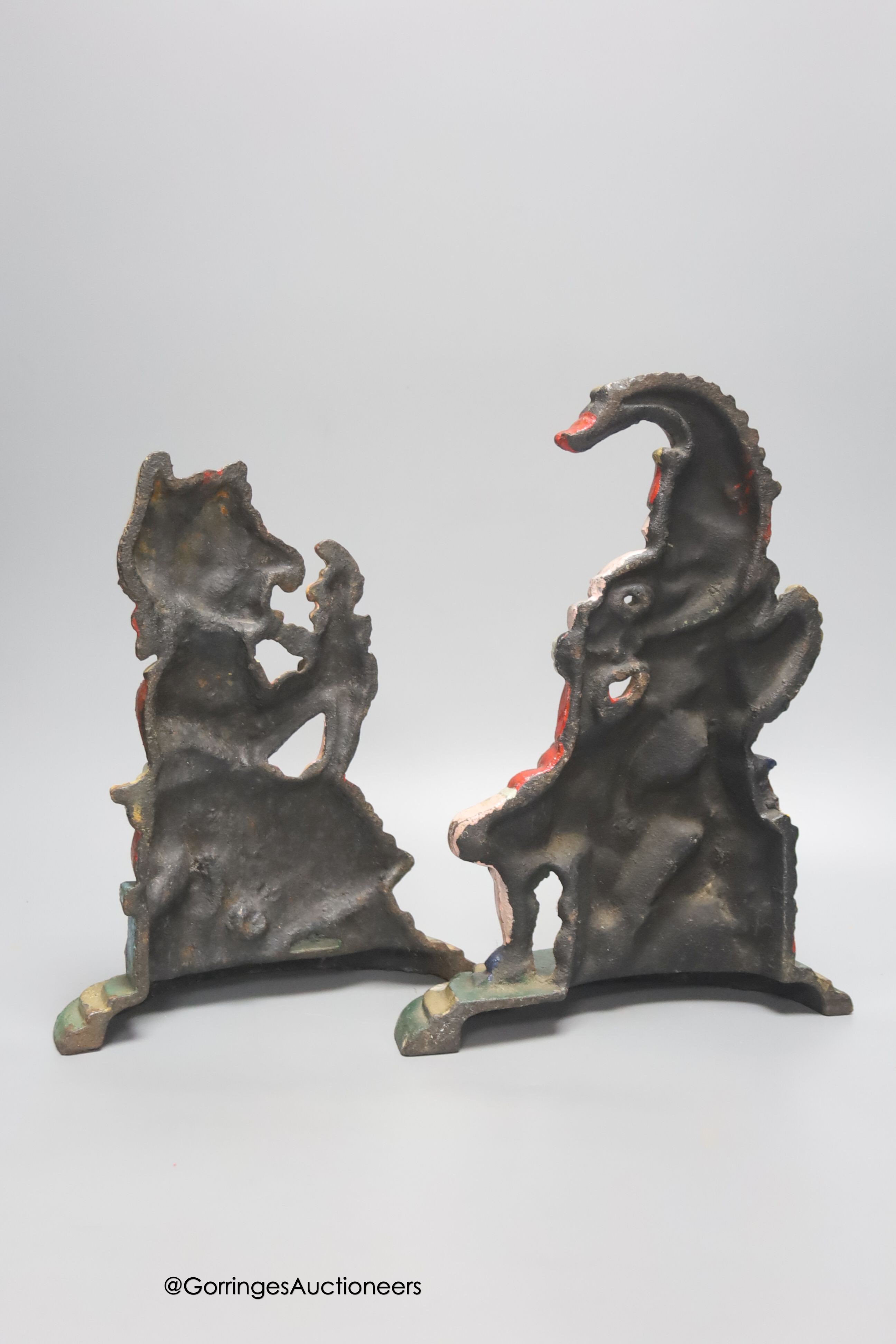 A pair of painted cast iron Punch and Judy door stops, height 30cm